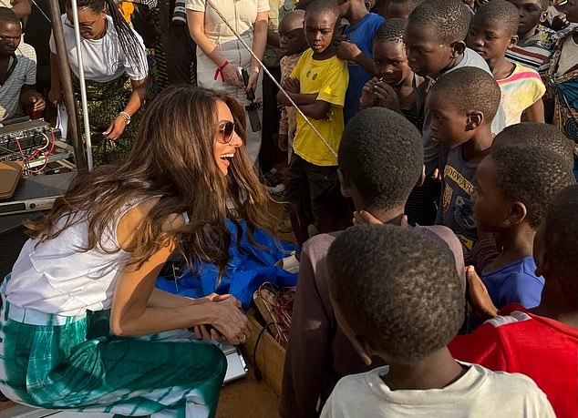 Clinics: She spent time with local children as part of one of the clinics, which aims to reach the most remote areas of Malawi