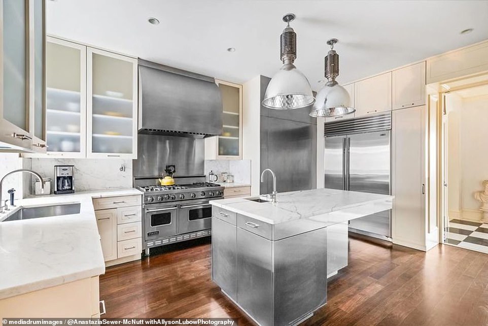 Highlights of the home include the gourmet chef's kitchen, which features a commercial six-burner Viking stove, a double Subzero refrigerator, and a large pantry.