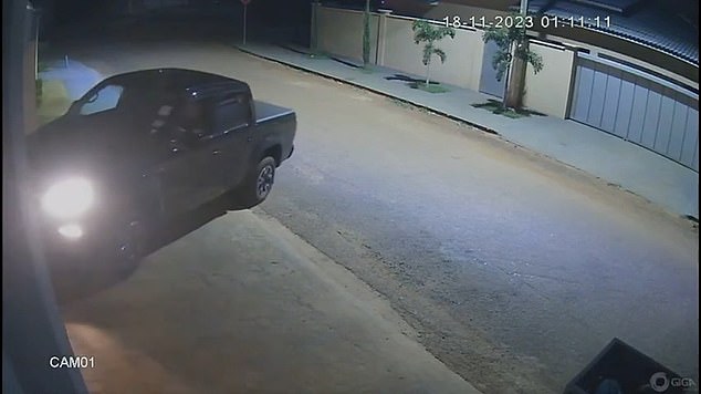 Still image from surveillance camera of Brazilian Mayor Naçoitan Leite ramming his pickup truck into his estranged wife's home before opening fire on her and her boyfriend, who were hiding in a bedroom
