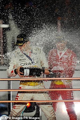 The drivers spray champagne, but they probably haven't drunk much