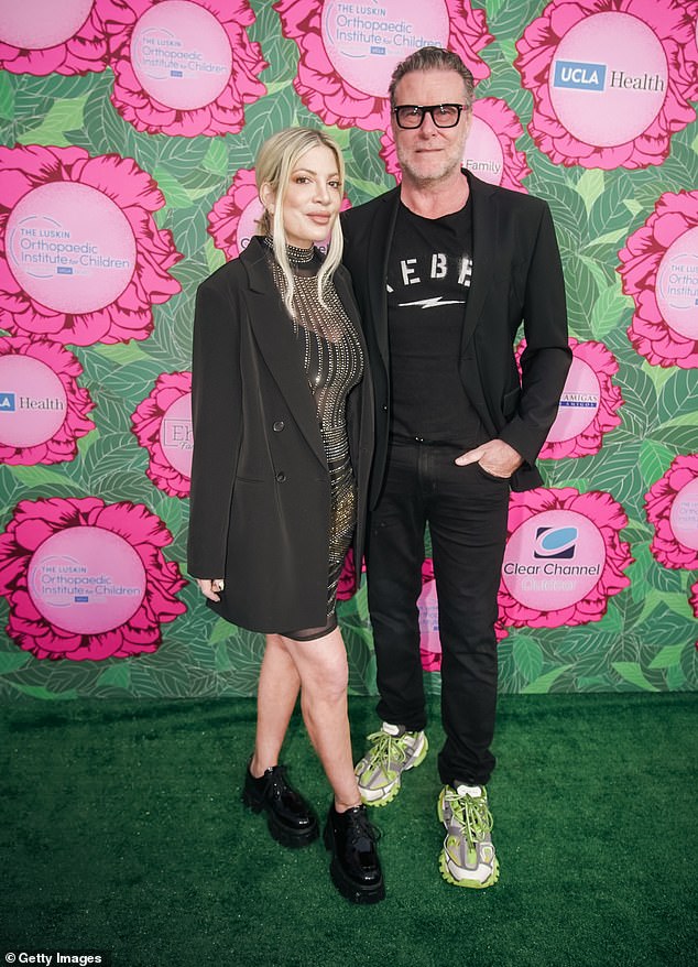 Dean McDermott announced on Instagram last June that he and Spelling were ending their long-term relationship.  Pictured in LA in June, prior to the announcement