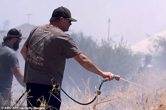 Residents of Kwinana are using hoses in an attempt to extinguish a forest fire that is threatening homes