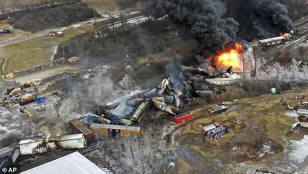 Parts of a Norfolk Southern freight train are set on fire in East Palestine on February 4