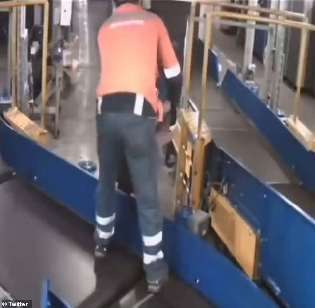 An airport baggage handler appeared on a security camera and handed the boy to a colleague moments after they spotted the child on the conveyor belt