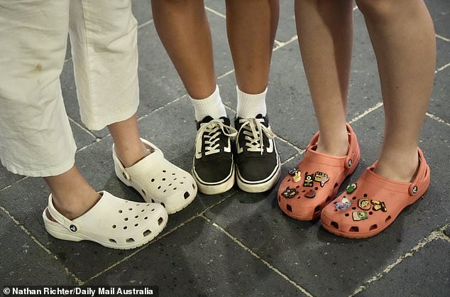 Once vilified for being 'ugly', Crocs are now the footwear of choice for Schoolies week