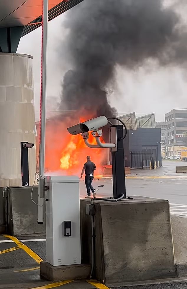 The giant fire plume is seen in the aftermath of the crash that killed a 56-year-old businessman and his wife