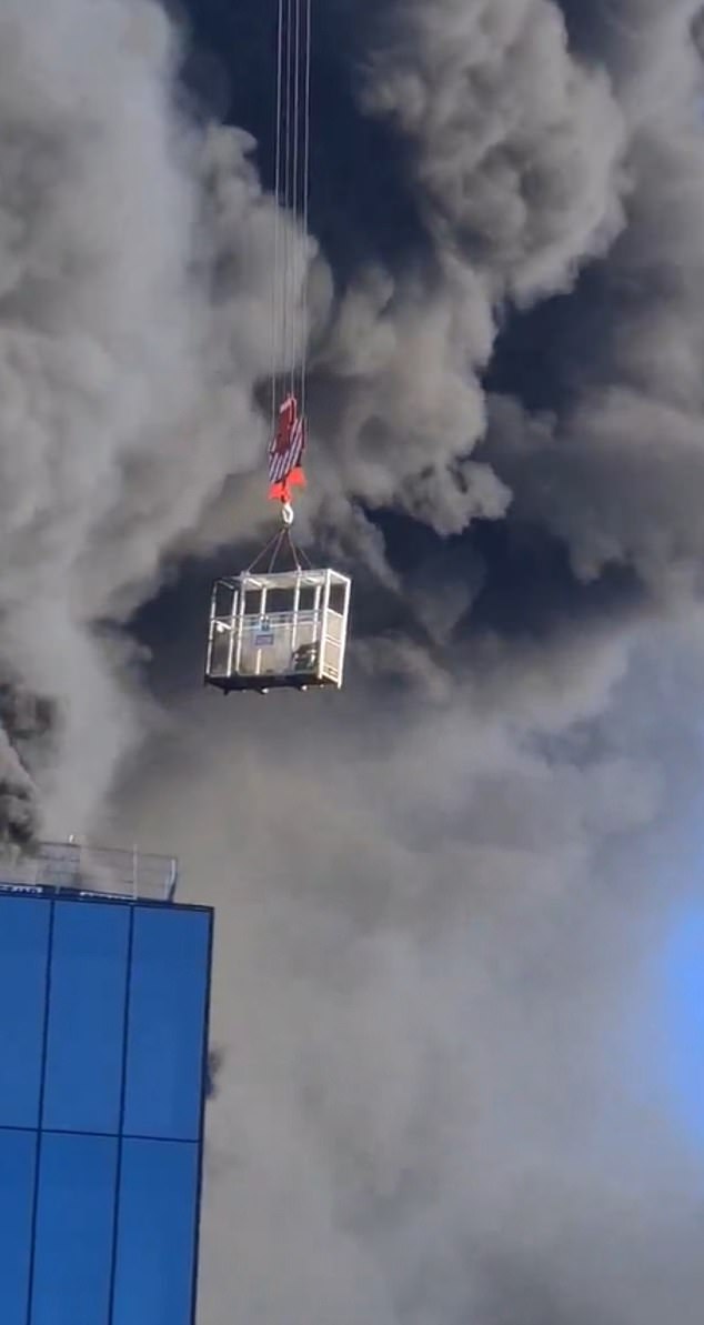 Images and videos showing thick black smoke billowing from a building under construction have emerged on social media