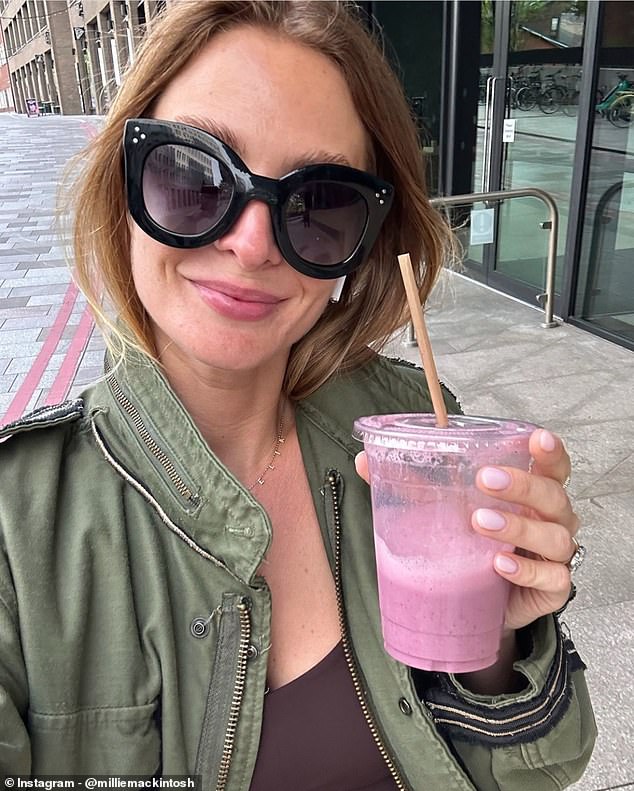 Feeling good: Millie shared herself enjoying a purple smoothie and wearing huge black sunglasses