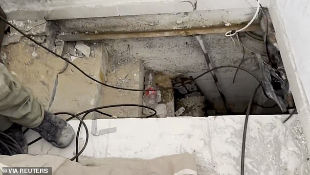 A view of what the Israeli military says is an opening to a Hamas tunnel under a house near Al Shifa Hospital on Thursday