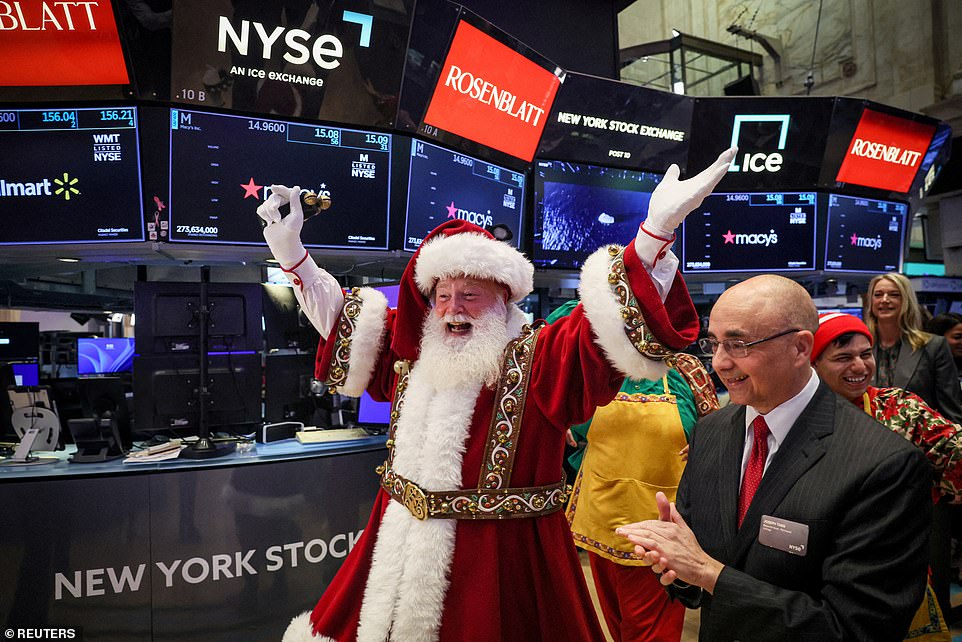 Before the parade began, the Macy's Santa Claus appeared on the trading floor of the New York Stock Exchange