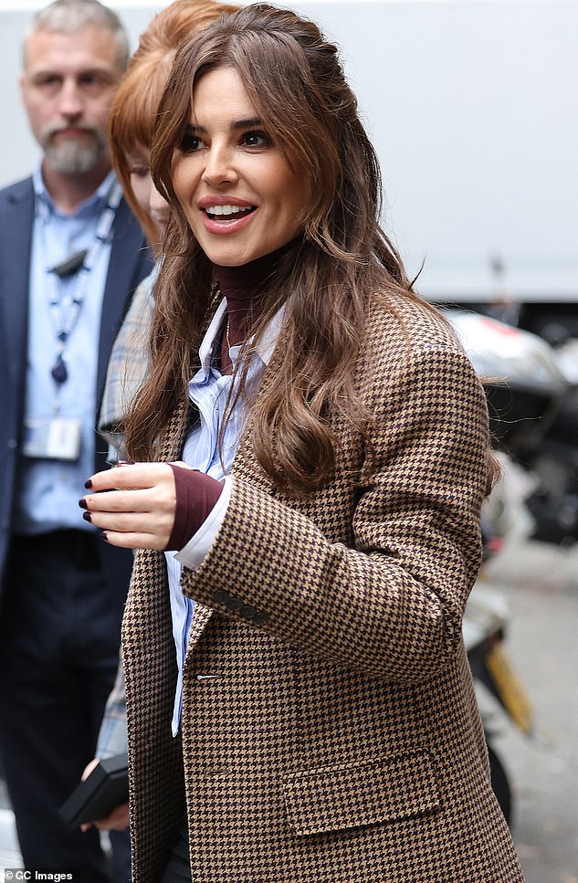 Tip?  Cheryl teased in the BBC Radio 2 interview: 'Can I just be blunt?  Glastonbury didn't even ask us, but it's a nice idea, isn't it?'  (Image: Cheryl wears a bright blue shirt, burgundy turtleneck and black leather pants on Thursday morning)