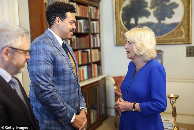 Camilla beamed as she mingled with some guests at Clarence House.  Pictured chatting with Jonathan Escoffery, who has been nominated for If I Survive You