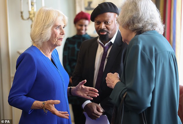 Camilla and Sir Ben Okri - a British poet and novelist - were pictured chatting with a guest at the reception