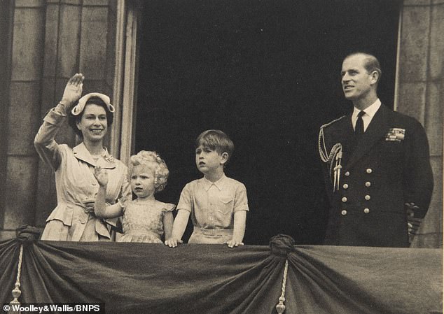 The Queen and Philip with a young Anne and Charles on the balcony of Buckingham Palace in the 1954 Christmas card