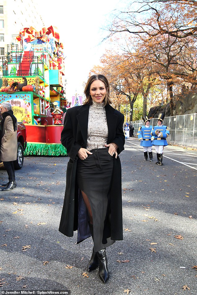 Babe: Katharine showed off her slim 6-foot figure in a gray knit turtleneck, tucked into a black midi skirt with a thigh-high slit and black boots selected by stylist Monica Rose