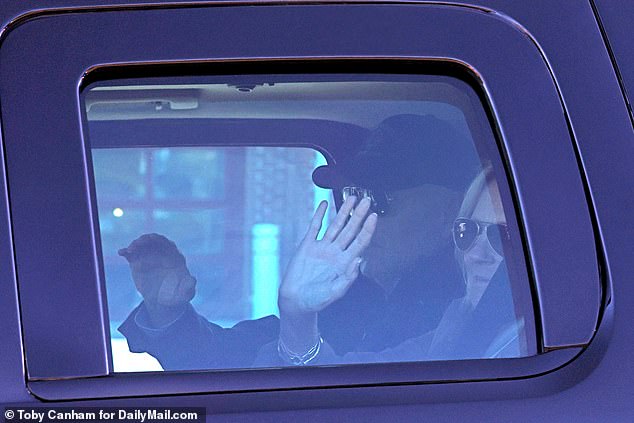 The president and first lady wave from their SUV after visiting the Nantucket Fire Department on Thanksgiving Day