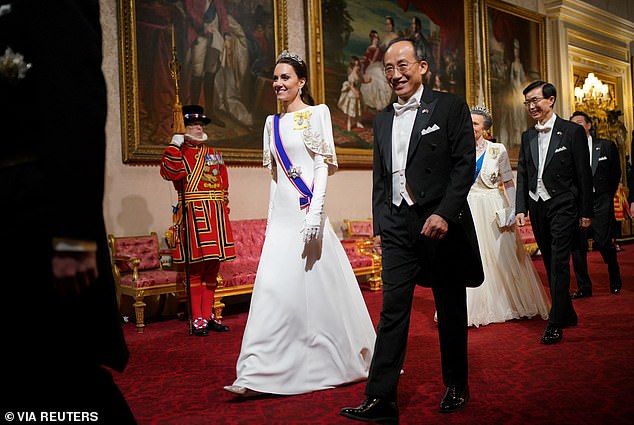 Catherine, Princess of Wales, accompanies Hoo Kyung-ho, Deputy Prime Minister of South Korea, at the state banquet