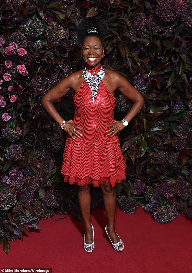 Legend: Baroness Floella Benjamin stuns in a red ruffled dress for the event