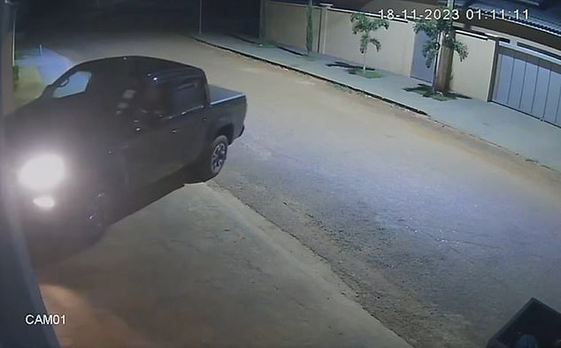 A still image from a surveillance camera reportedly showed Brazilian Mayor Naçoitan Leite ramming his pickup truck into his estranged wife's home before opening fire on her and her boyfriend, who were hiding in a bedroom