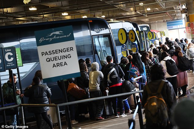 Travelers wait for Greyhound buses at Union Station in Washington, DC on Wednesday