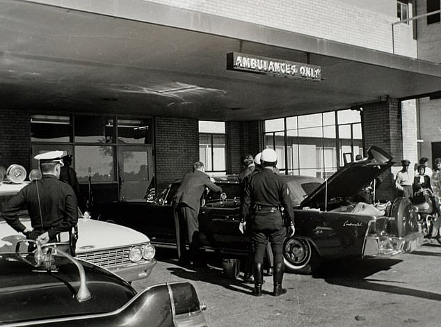 The presidential limousine sits outside Parkland Hospital after the shooting of John F Kennedy