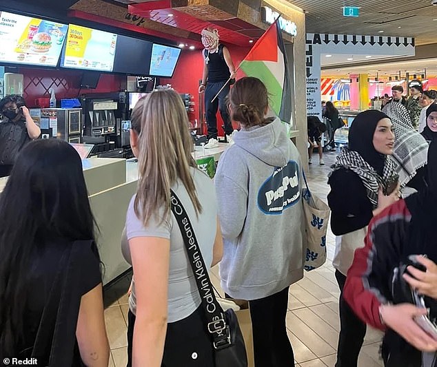 Pro-Palestinian supporters marched down Swanston Street to the Melbourne Central Shopping Centre, where many gathered in the food court