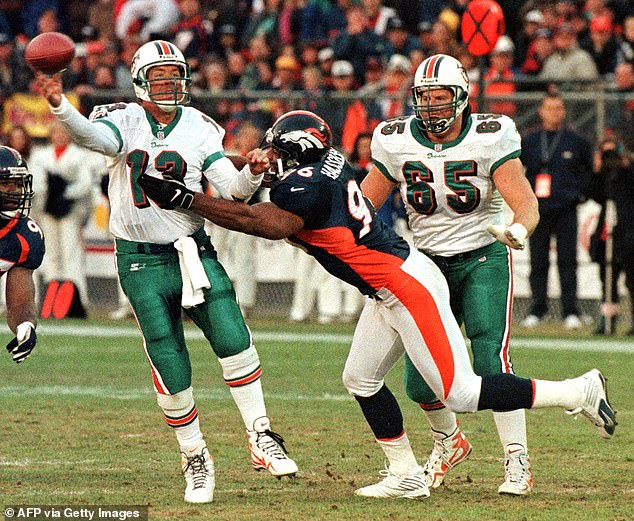 Hasselbach puts pressure on Miami Dolphins quarterback Dan Marino in 1999