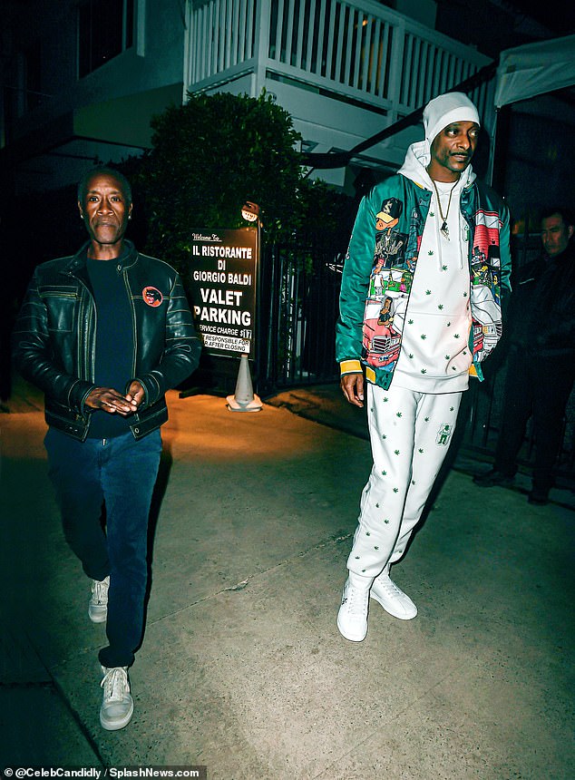 Dinner time: The 52-year-old rap superstar enjoyed a hearty Italian meal at Giorgio Baldi with his famous friend Don Cheadle (L)