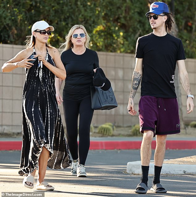 Family time: The 33-year-old blonde from Vanderpump Rules enjoyed a sun-filled stroll with her mother Lisa Burningham and younger brother Easton Burningham
