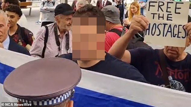 A video on TikTok shows police confronting a man unfolding an Israeli flag