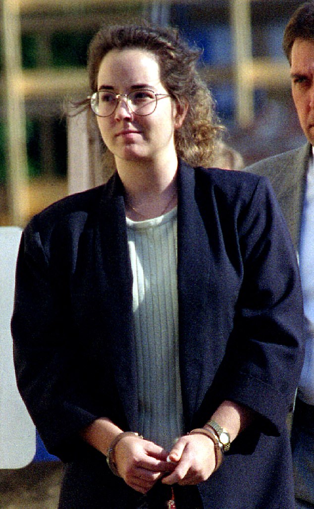 Smith is led from the Union County Courthouse after the first day of testimony in the penalty phase of her trial.  Smith was convicted of murdering her sons on October 25, 1994