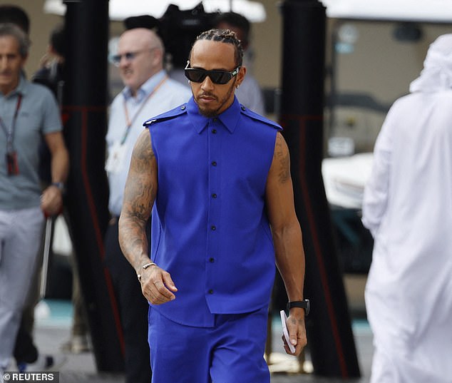 Stylish: Lewis looked confident as ever, putting his intricate tattooed sleeves and toned arms on full display