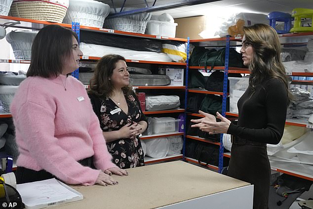 With her hair in loose curls and a natural makeup look, the royal looked at ease as she chatted with staff