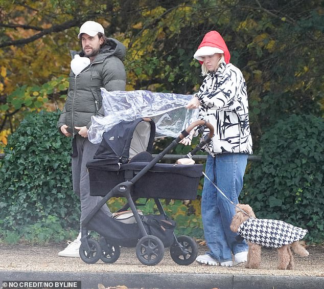 Concentrated: Roxy looked focused as she placed the rain cover over the stroller