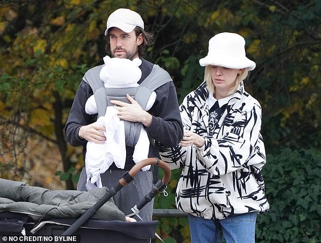 Stunning: New mum Roxy, 32, looked sensational in her quirky white coat with a black scribble pattern