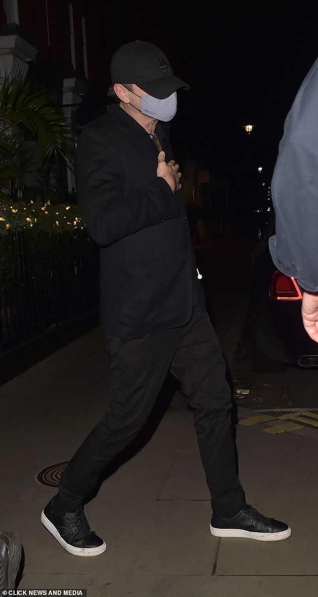 Understated: Leo strolled out of the celebrity hotspot in the early morning hours