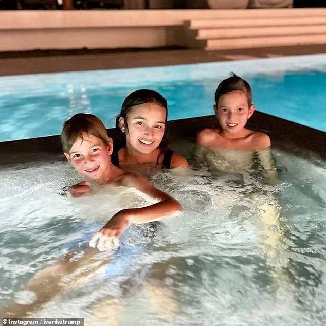 The mother-of-three, 42, shared a glimpse into her holiday via Instagram on Thursday evening, writing: 'Night swimming with these turkeys.  Happy Thanksgiving'