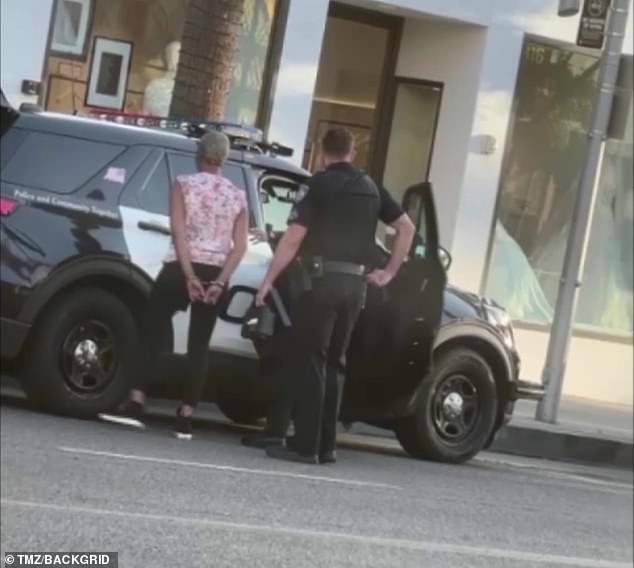 Under arrest: The 43-year-old Girls Trip star was seen being escorted into a police car after being taken into custody for a DUI arrest