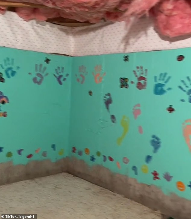 The 'creepy' room was covered in bright blue paint, children's drawings, footprints and on one of the walls the words 'Love Shack' were painted along with flowers and butterflies