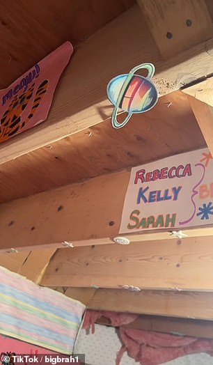 The names Rebecca, Kelly and Sarah are strung from a poster on the wall