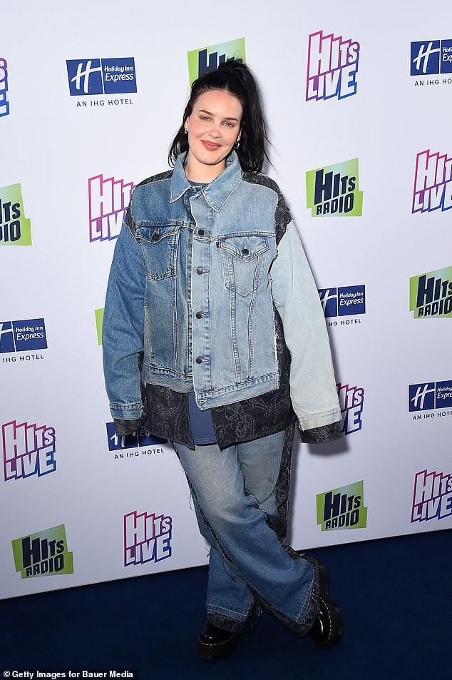 Making a statement: the English singer showed off her sense of style in an oversized patched denim jacket and matching wide-leg trousers