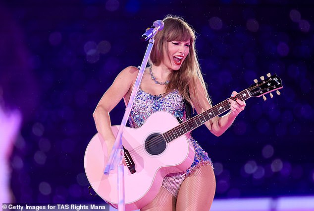 Having fun: Swift seemed to be having a good time as she performed for the crowd
