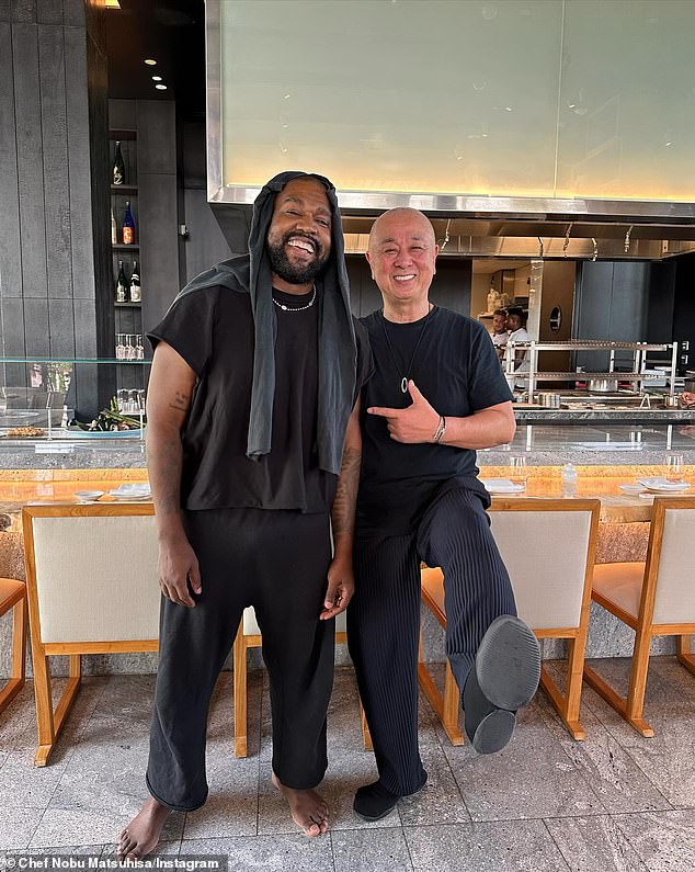 Strange choice: West was also pictured barefoot in photos posted by chef Nobu Matsuhisa at the Dubai location of his popular Nobu franchise