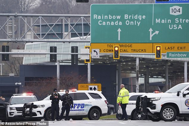 Law enforcement personnel block the entrance to the Rainbow Bridge, Wednesday, Nov. 22, 2023, in Niagara Falls