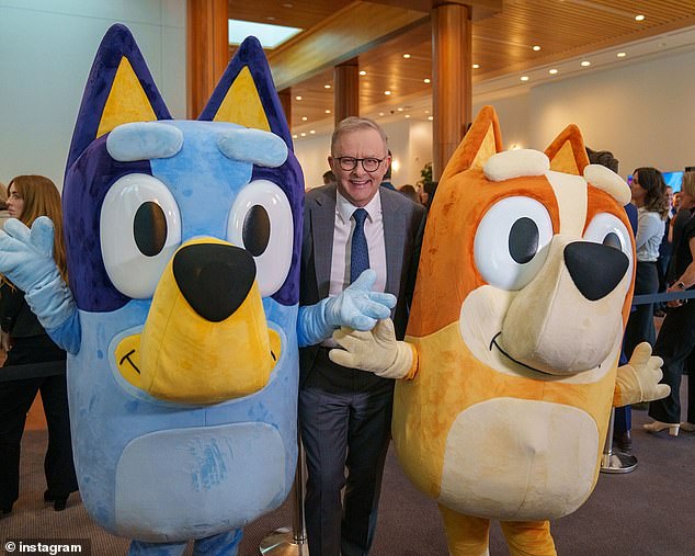 Anthony Albanese posed for photos with TV character Bluey on the day of the Navy's clash with China, which has already earned him a backlash for being 'tone deaf' amid the situation in the Middle East