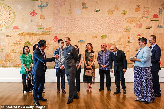 He chatted animatedly with attendees as he walked through the exhibition, before greeting British Ambassador to Indonesia Dominic Jermey.