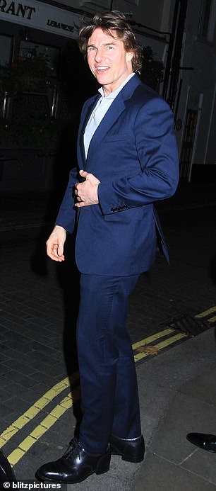 Stylish: Tom washed himself thoroughly and completed his outfit with a pair of polished black brogues with a Cuban heel