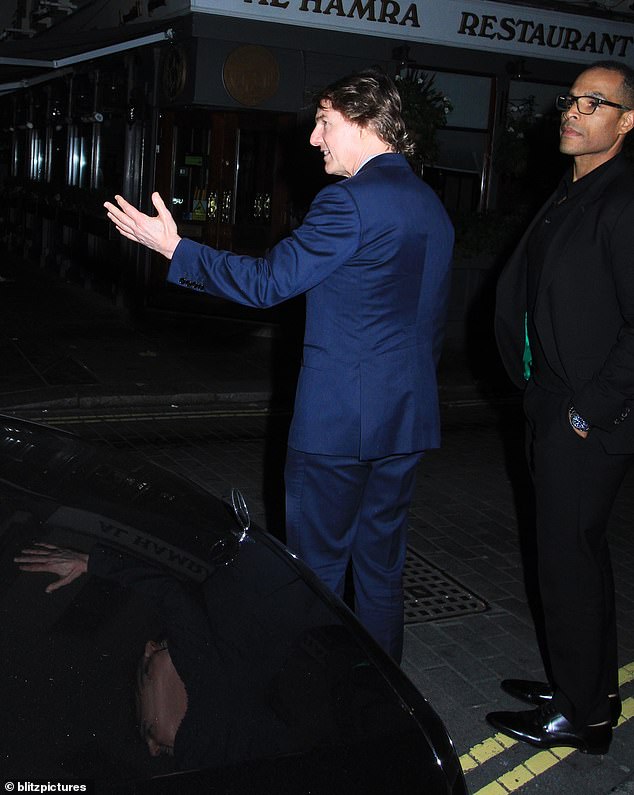 Courteous: Tom was also seen waving at other cars passing in front of him