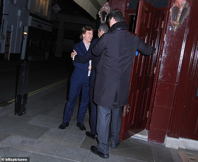 All smiles: Tom looked cheerful as he said goodbye to the club's staff