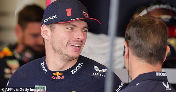 Dutch Red Bull Racing driver Max Verstappen speaks with a technician in the pits during the third practice session for the Formula 1 Grand Prix of Abu Dhabi at the Yas Marina Circuit in the Emirati city on November 25, 2023. (Photo by Giuseppe CACACE / AFP) (Photo by GIUSEPPE CACACE/AFP via Getty Images)